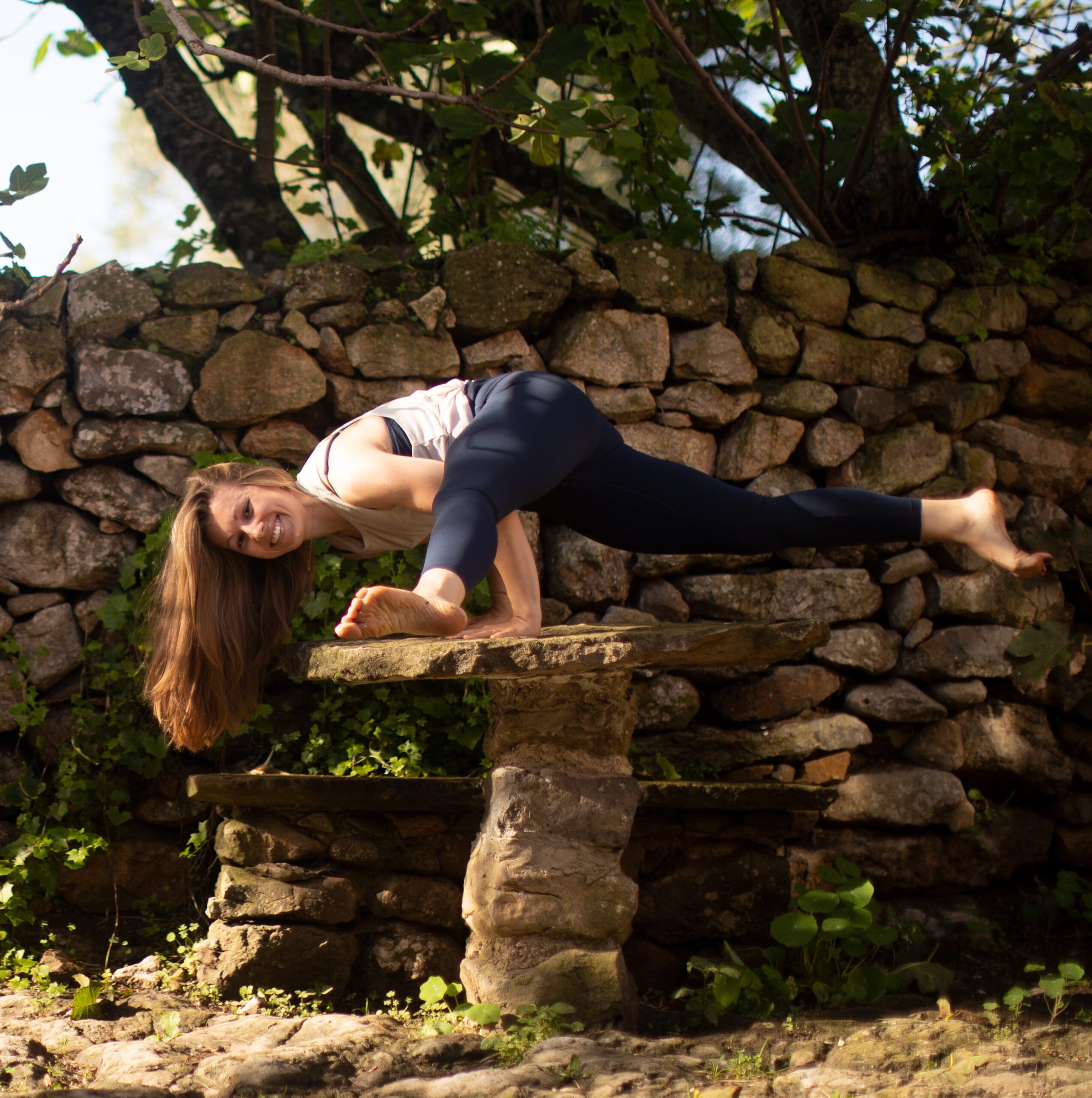 Vinyasa yoga pose on stone